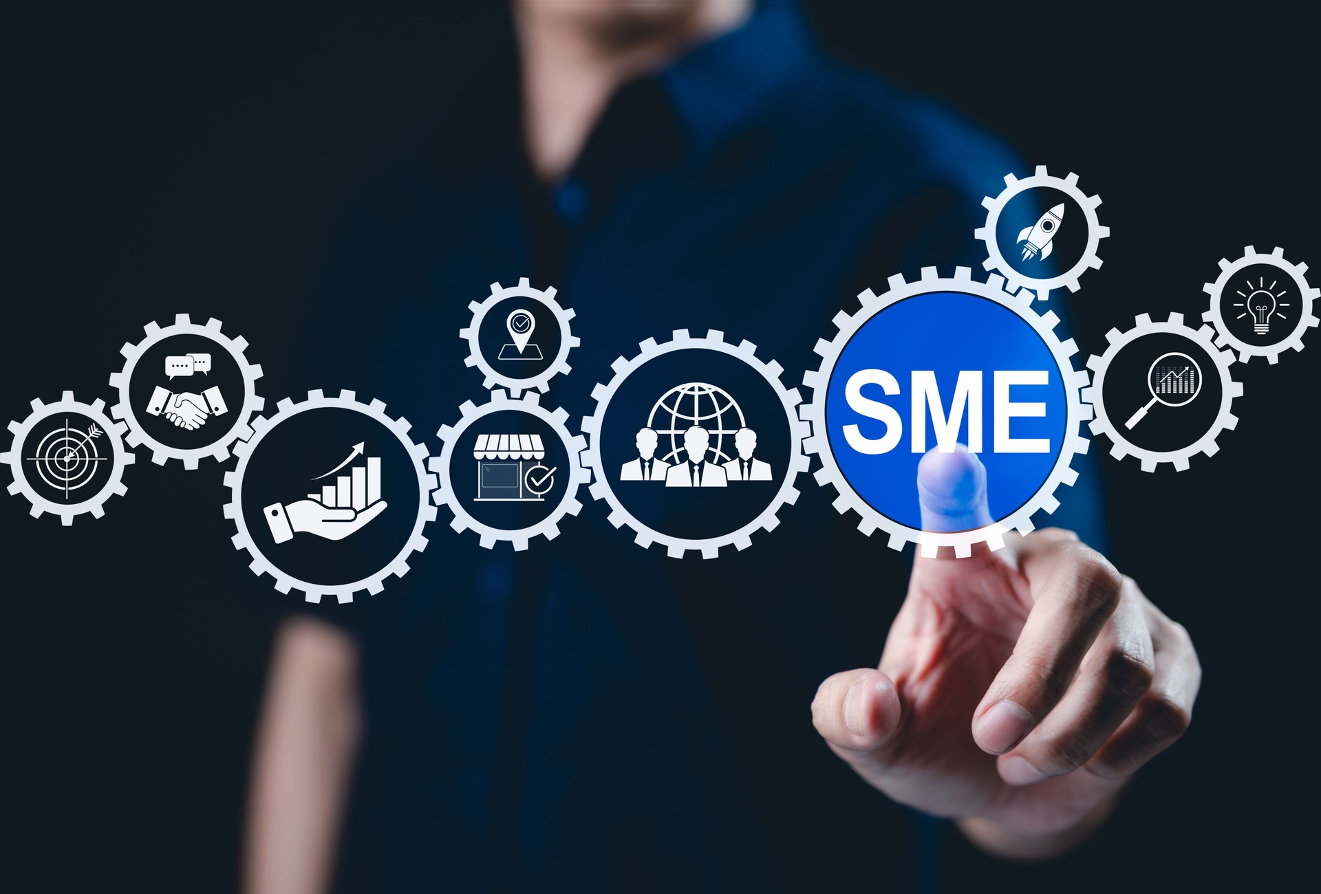 SME Business Growth and Development Concept. Businessman points to an icon "SME" with various business-related icons, symbolizing growth, strategy, and success of small and medium-sized enterprises.